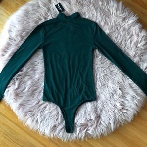 green turtleneck bodysuit